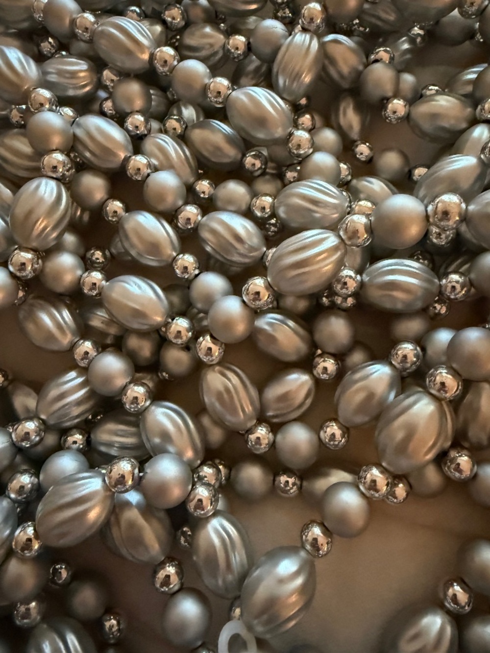 string of silver plastic beads